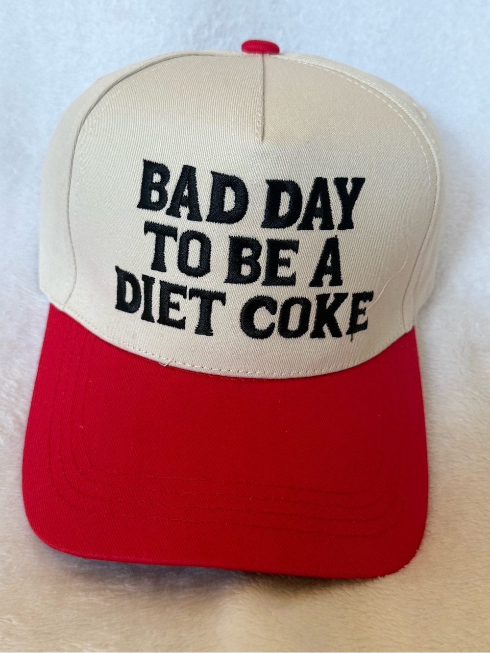 Beige & Red Trucker Hat with Bold Black Slogan